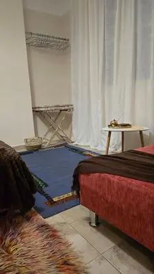 a room with a bed and a table and a rug at ATHENS O'GERA escape in Athens