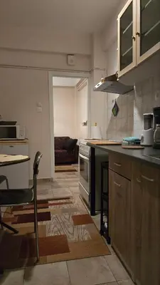 a kitchen with a counter and a stove top oven at ATHENS O'GERA escape in Athens