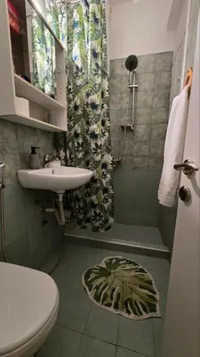 a bathroom with a sink and a toilet and a shower at ATHENS O'GERA escape in Athens