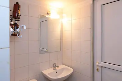 a bathroom with a sink and a mirror at Piraeus Pasalimani X6 near metro in Piraeus