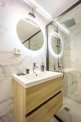 a bathroom with a sink and a mirror at GK Agorakritou in Athens