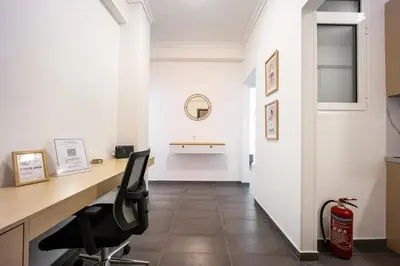 an office with a desk and chairs in a hallway at GK Agorakritou in Athens