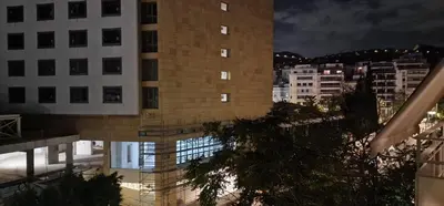 a tall building in a city at night at New Luxury Studio, Near Hilton, Central , Ventiri Suite 7 in Athens