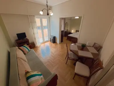 a living room with a couch and a table at Urban 16 in Athens