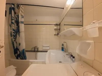 a bathroom with a tub and a sink and a toilet at Urban 16 in Athens