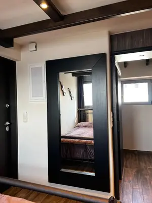 a mirror in a room with a bed in it at Private hottub Athens Skythens omonoia in Athens
