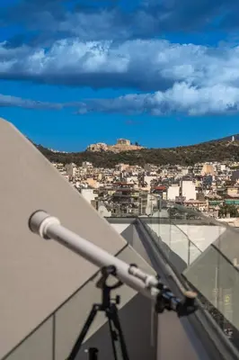 a view of a city from the roof of a building at Elite Penthouse with Heated Pool and SkylineView in Piraeus