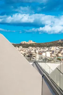 a view of the city from the roof of a building at Elite Penthouse with Heated Pool and SkylineView in Piraeus