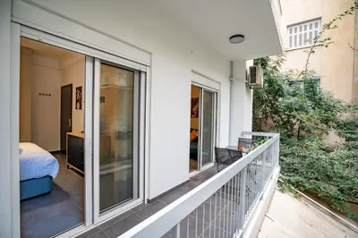a balcony with sliding glass doors on a house at Evaggelismos Apt Metro Station 1 bdrm 2pers by MPS in Athens