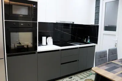 a kitchen with a microwave and a stove top oven at Golemis Apartments in Athens