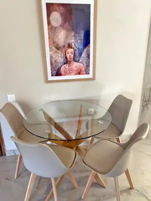 a glass table and chairs in a room with a picture at Agora Apt2, Metro Station, 2 bdrms in Athens