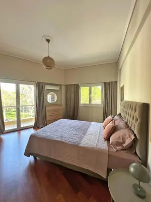 a bedroom with a large bed and two windows at Agora Apt2, Metro Station, 2 bdrms in Athens