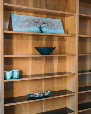 a book shelf with a plate of food on it at 4BED apartment in the center of Athens in Athens