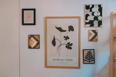 a picture of flowers on a wall with framed pictures at 4BED apartment in the center of Athens in Athens