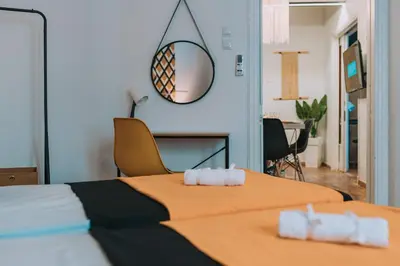 a bedroom with a bed with two towels on it at 4BED apartment in the center of Athens in Athens