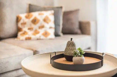 a coffee table in a living room with a couch at Exclusive Suite by CloudKeys in Athens