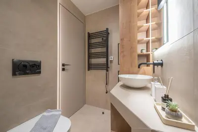 a bathroom with a sink and a toilet and a shower at Exclusive Suite by CloudKeys in Athens