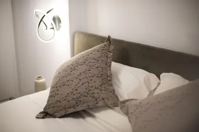 a pillow sitting on top of a bed at Apartment by the beach in Anavissos