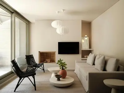 a living room with a couch and chairs and a tv at Amanda Blue in Athens