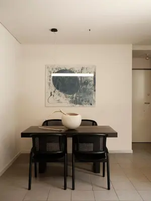 a dining room table with two chairs and a bowl on it at Amanda Blue in Athens