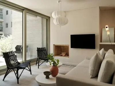 a living room with a couch and a tv at Amanda Blue in Athens