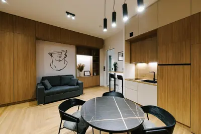 a kitchen and a dining room with a table and chairs at G Residence in Athens
