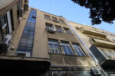 a tall building with windows on the side of it at G Residence in Athens