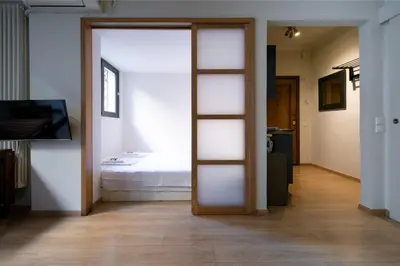 a room with a door leading to a bedroom at The studio in the heart of Athens-Plaka in Athens