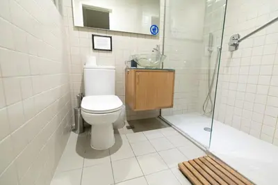 a bathroom with a toilet and a shower at The studio in the heart of Athens-Plaka in Athens