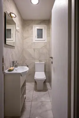 a bathroom with a white toilet and a sink at Mia Homes - Heart of Athens in Athens