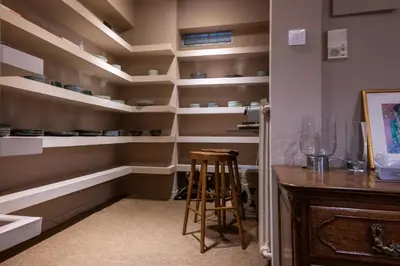 a kitchen with shelves and a stool in a room at Lux Downtown Kolonaki in Athens
