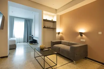 a living room with a couch and a table at Belle Athenes Apartements in Athens