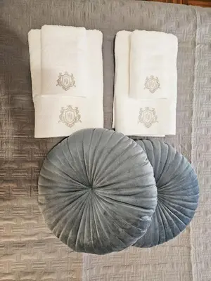 two plates and napkins on a table with towels at LYT house at the foot of the Acropolis in Athens