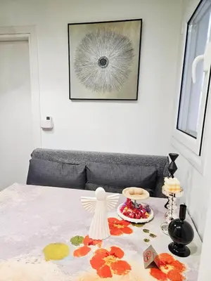 a table with a plate of food on top of a bed at LYT house at the foot of the Acropolis in Athens