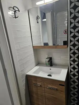 a bathroom with a sink and a mirror at LYT house at the foot of the Acropolis in Athens