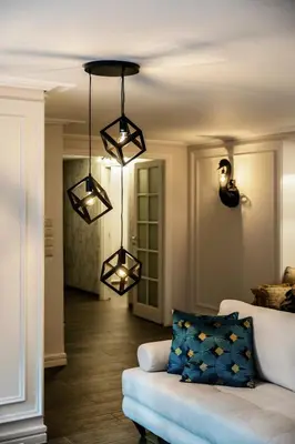 a living room with a couch and lights at MZ Kolonaki Hills in Athens