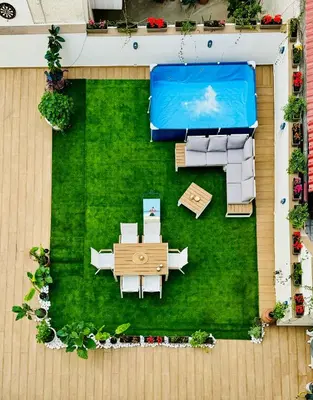 an overhead view of a backyard with a pool and furniture at Apartments Sunshine G1 in Athens