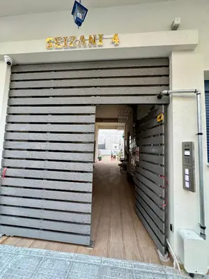 a garage door with a sign on top of it at Apartments Sunshine G1 in Athens