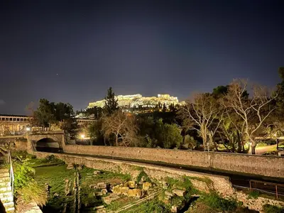 a view of a bridge and a city at night at Reservoir Athens in Athens