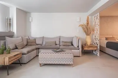 a living room with a couch and a bed at El Mar, Pool House with 3 BDR, 7 min from beach in Saronida