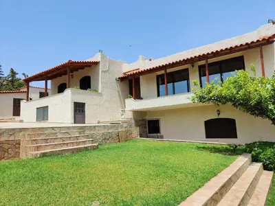a large house with a yard in front of it at Summer Breeze villa in Saronic Gulf in Anavissos