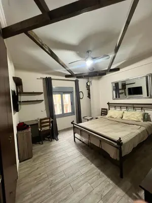 a bedroom with a bed in a room with a ceiling at Penthouse Athens centre-Skythens in Athens