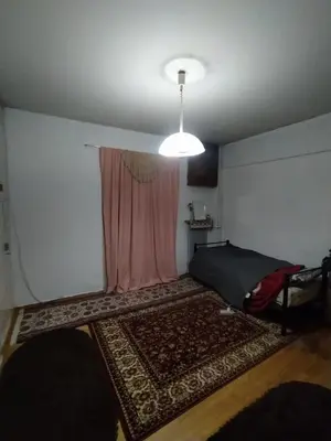 a room with a bed and a pink curtain at أثينا in Athens