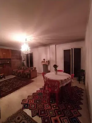 a living room with a table and a couch at أثينا in Athens