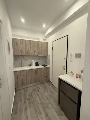 a kitchen with a sink and a counter top at ATH Gray House in Athens