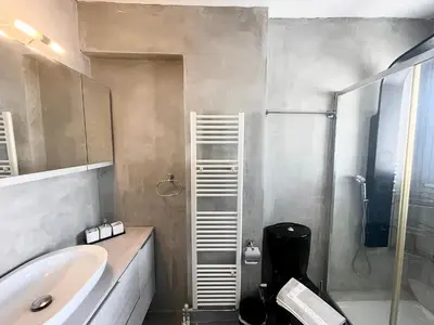 a bathroom with a sink and a shower at Metaxourgio Apartments in Athens