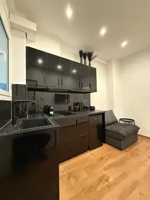 a kitchen with a sink and a counter top at ATH Lux apartment in Athens