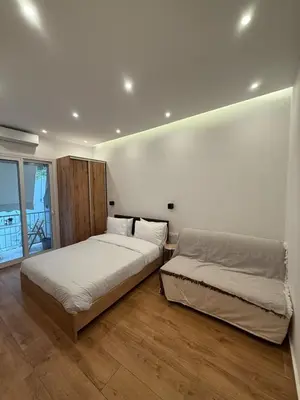 a bedroom with two beds and a window at ATH Cozy Studio in Athens