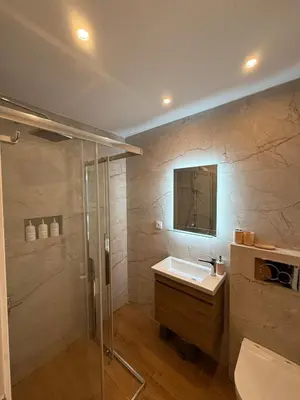 a bathroom with a sink and a shower at ATH Cozy Studio in Athens