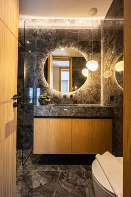 a bathroom with a sink and a mirror at The Athenian Luxury Penthouse by GK Properties in Athens